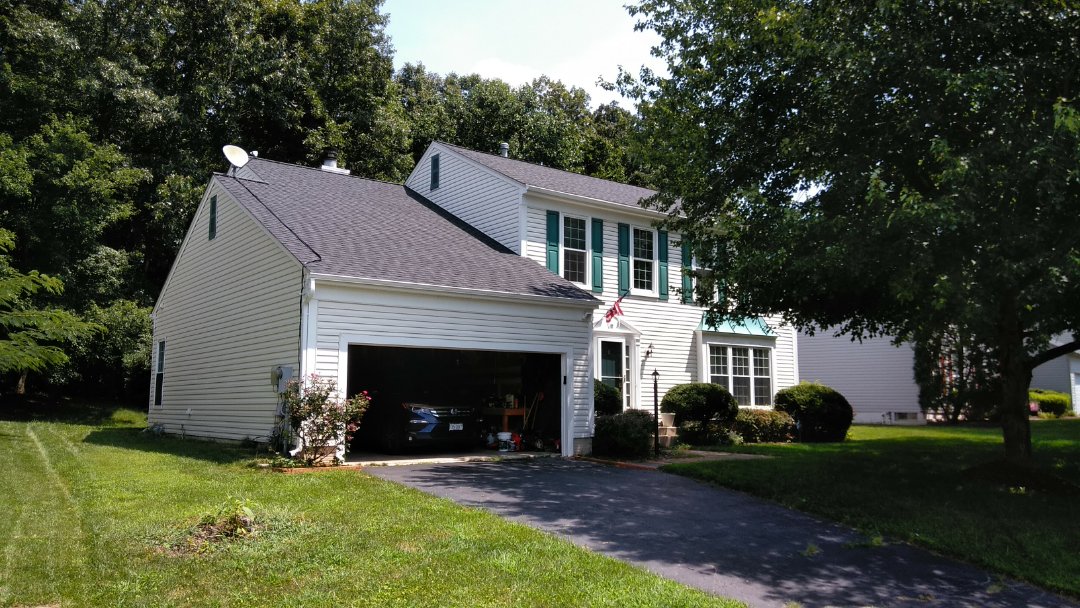 Woodbridge, VA - Severe winds with damaging storms caused numerous shingles to be removed from this 3-tab shingled roof and damaged its aluminum siding. We replaced the roof with CertainTeed Landmark architectural shingles and we replaced the siding with Norandex Sagebrush Super Premium vinyl siding. Woodbridge, VA - Severe winds with damaging storms caused numerous shingles to be removed from this 3-tab shingled roof and damaged its aluminum siding. We replaced the roof with CertainTeed Landmark architectural shingles and we replaced the siding with Norandex Sagebrush Super Premium vinyl siding.