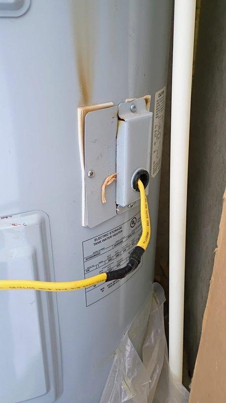 Responded to no hot water call for tank-type water heater. Diagnosed leaking unit with apparent junction box and electrical connection issues. Installed new State brand water heater with proper electrical connections and replaced deteriorated supply lines, restoring hot water service to residence.