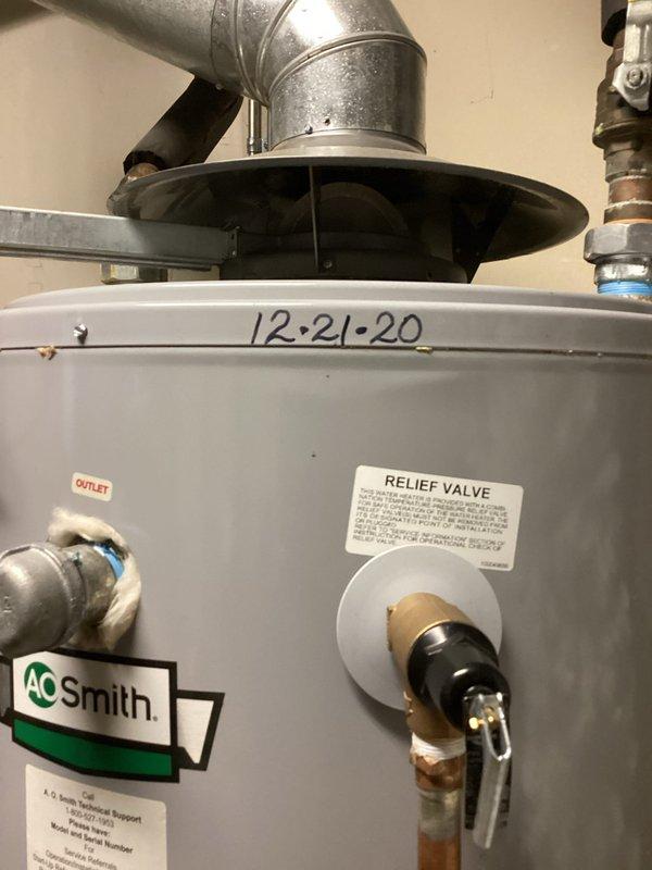 Responded to service call for A.O. Smith water heater leaking despite being operational. Conducted thorough inspection of 5-year-old unit installed in December 2020. Identified leak originating from temperature and pressure relief valve, replaced valve and verified proper operation of unit before departure.