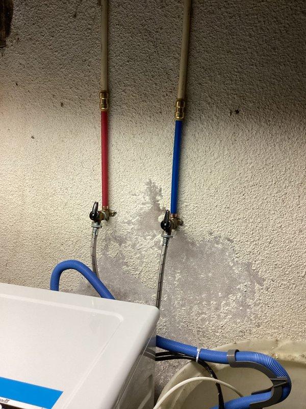 Responded to emergency call for broken pipes resulting from third-party washer installation in basement. Upon inspection, found damage to both hot and cold water supply lines with significant water staining on adjacent wall. Completed necessary repairs to restore proper water service, allowing homeowner to document damage for reimbursement claim against installation company.