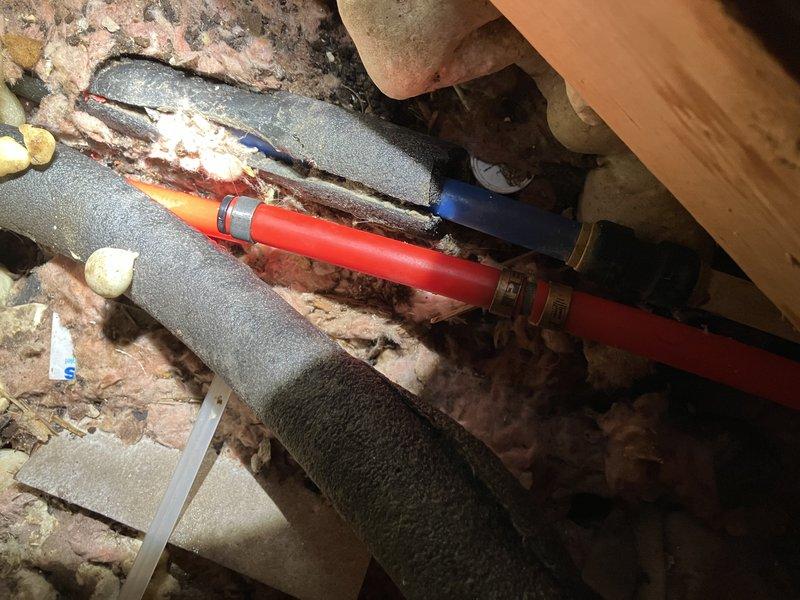 Responded to emergency call for a burst pipe under the washing machine. Upon arrival, accessed the existing cutout in the floor to inspect the leak area. Installed new shutoff valve on the compromised PEX line, which allows tenant to control water flow independently. Confirmed proper valve function and verified no active leaks after restoration of water service.
