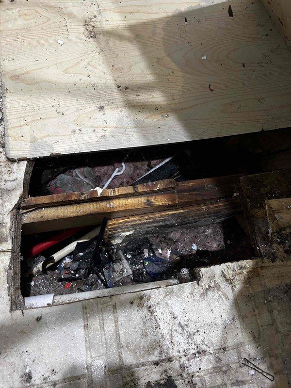 Responded to emergency call for a burst pipe under the washing machine. Upon arrival, accessed the existing cutout in the floor to inspect the leak area. Installed new shutoff valve on the compromised PEX line, which allows tenant to control water flow independently. Confirmed proper valve function and verified no active leaks after restoration of water service.