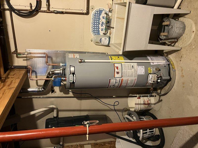 Successfully completed installation of 40-gallon draft vent water heater with standard configuration. System setup includes properly connected copper supply lines with appropriate valving, and verified proper ventilation pathway. All connections were tested and confirmed to be leak-free with normal operational parameters.