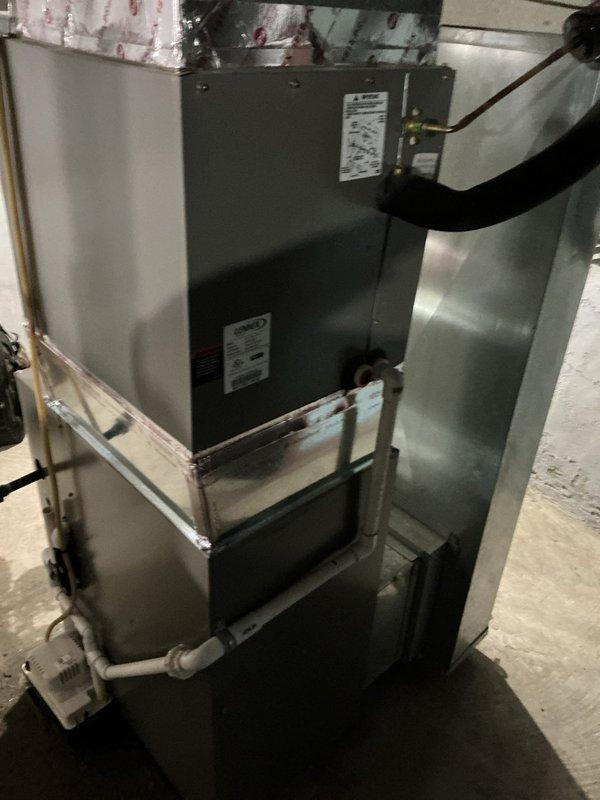 Successfully installed Lennox ML196UH045XE36BK furnace with T4 thermostat in residential basement. Properly connected unit to existing PVC venting system and return air filter, with all necessary gas, electrical, and ventilation connections completed according to manufacturer specifications.