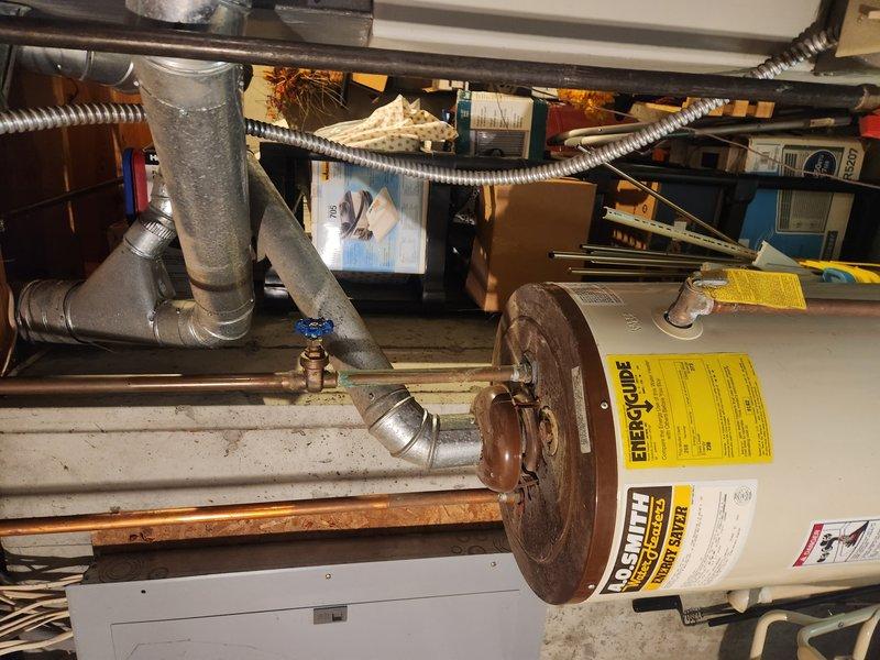 Responded to service call for a non-operational water heater with pilot light failure. Upon inspection of the 30-year-old A.O. Smith unit, determined the thermocouple was faulty and required replacement. Installed new thermocouple, cleaned pilot assembly, and verified proper operation of gas control valve. Tested system after repair with successful pilot light retention and normal heating cycle resumed.