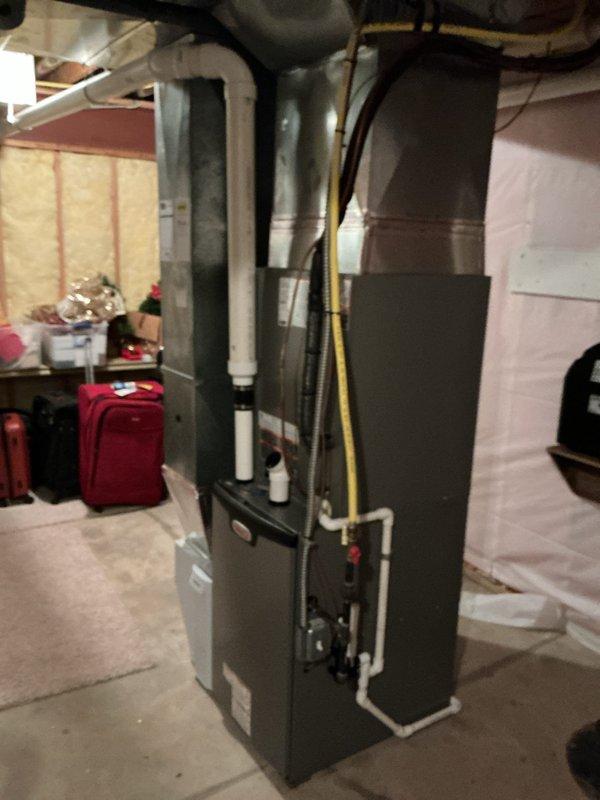 Successfully completed full HVAC system installation including Lennox EL297UH090XV48C furnace, ML17KC2-048 condensing unit, and CK40CT-48C cased coil in basement utility room. Installation included 1620 media filter, T6 Wi-Fi thermostat, and replacement humidifier pad, with all necessary ductwork connections and PVC drainage properly secured and tested.