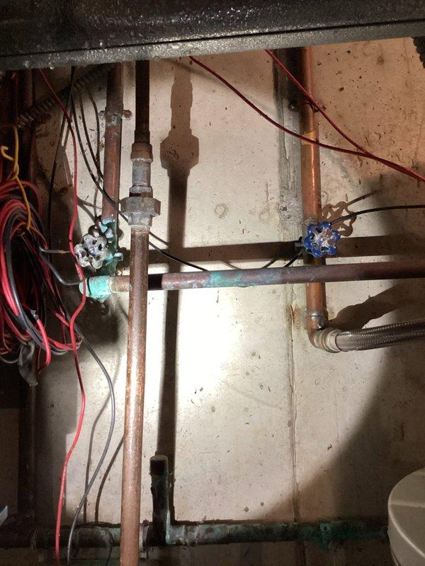 Responded to emergency water leak call where customer experienced 6-8 inches of basement flooding. Upon arrival, water had been drained and main supply was shut off. Inspection revealed oxidation and moisture damage to copper supply lines in the utility area. Replaced damaged section of copper piping and installed new shutoff valve to prevent future leakage. Tested system for proper operation after repairs were completed.