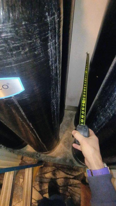 Responded to service call for a Kinetico water softener stuck in "dump" mode. Diagnosed faulty valve mechanism in the 16-year-old unit causing continuous regeneration cycle. Took measurements of the system components and inspected the cylindrical filtration tanks to determine appropriate replacement parts. Restored system to normal operation by repairing the malfunctioning valve assembly.