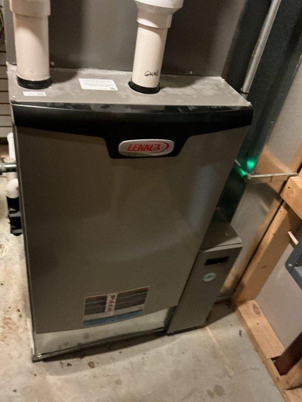 Diagnosed issue with 6-year-old Lennox furnace that was blowing cold air despite customer replacing thermostat batteries. Determined system was actually operational with green indicator light illuminated. Performed comprehensive inspection of the furnace, verified proper intake/exhaust ventilation through PVC piping, and confirmed heating functionality. Reset thermostat which resolved the "low battery" warning.