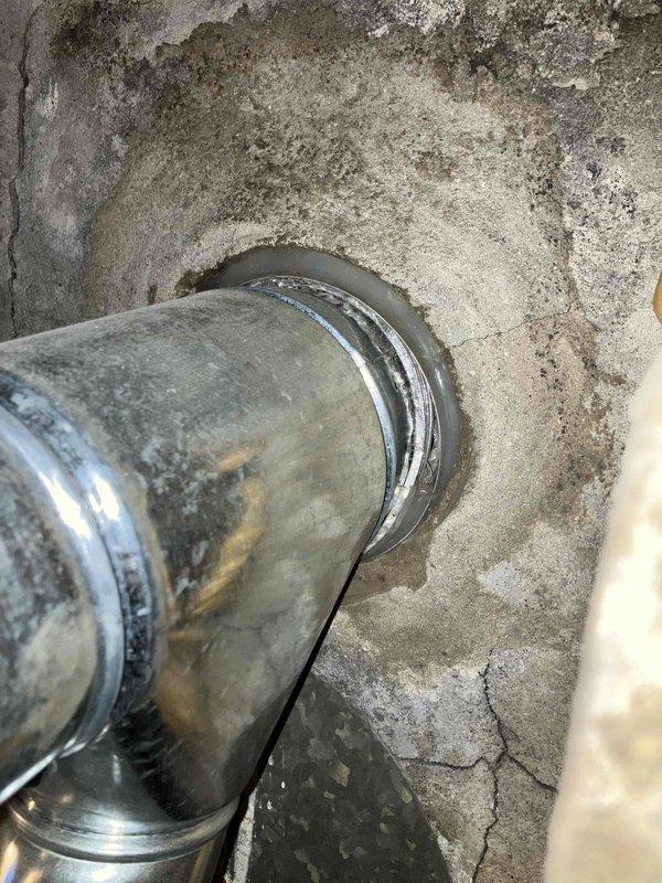 During inspection, found furnace inoperable with tripped upper rollout switch. Upon reset and operation, observed heavy flames with significant orange coloration. Examination revealed multiple cracks and voids in heat exchanger, rendering the system unsafe. Documented damaged ductwork with torn insulation and compromised connections. Unit requires immediate replacement for safety compliance.