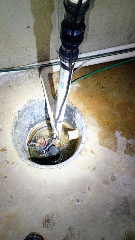 Responded to water leak call in customer's basement. Inspected sump pump system and found issues with the discharge pipe connection. Replaced damaged rubber coupling and secured fittings to prevent further water seepage around the sump pit area.