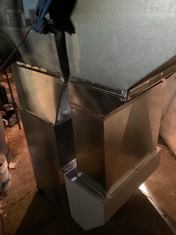 Installed new Lennox ML180UH090E48B furnace with T4 thermostat, 1620 media filter, and connected to existing venting system for immediate heat restoration. Chimney liner installation scheduled pending favorable weather conditions. Complete system includes properly secured metal ductwork with sealed joints and connections to ensure optimal performance.