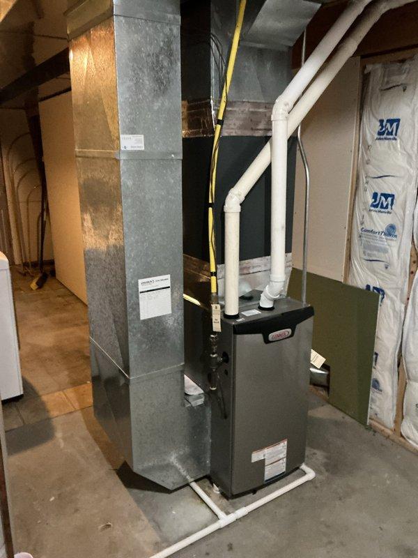 Successfully installed Lennox EL297UH070XV36BK furnace in residential basement, including connection to existing thermostat and return filter. Completed proper system testing with diagnostic equipment to verify optimal operation, with all ductwork and PVC ventilation properly connected according to manufacturer specifications.