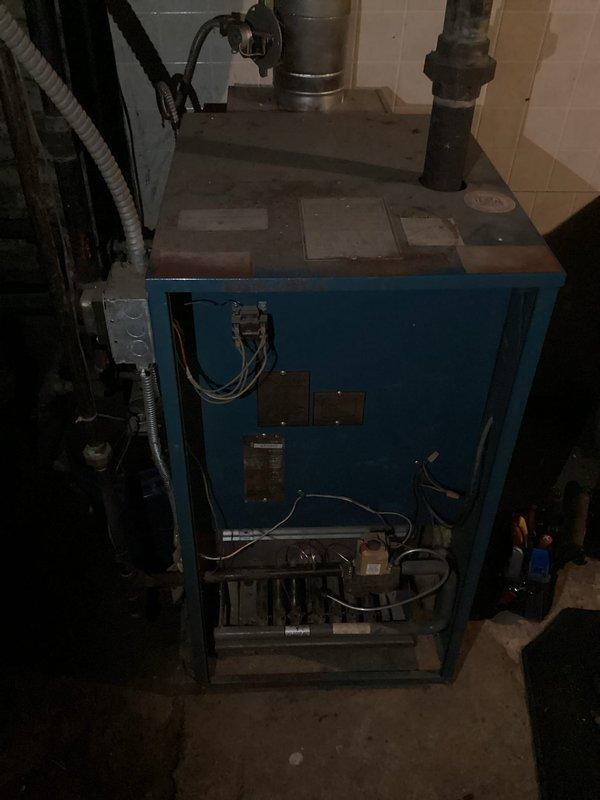 Responded to no heat call for 28-year-old boiler system. Diagnosed leaking water intake pipe and non-functioning ignition. Replaced damaged intake pipe, cleaned corroded connections, and restored proper operation after verifying system safety controls and combustion parameters.