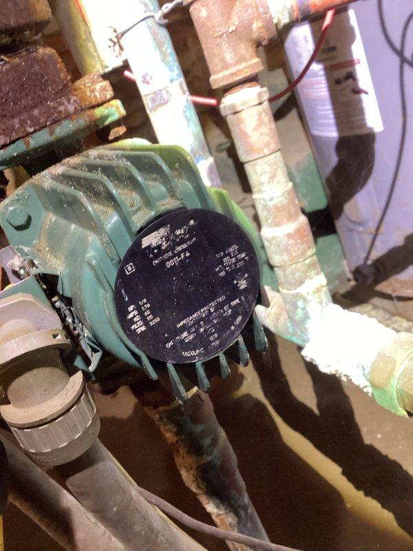 Responded to boiler system not maintaining temperature setpoint. Inspection revealed significant corrosion and oxidation on copper supply lines and fittings. Circulation pump showed signs of wear with partially illegible specification plate. Serviced system components and restored proper heating function to match thermostat settings.