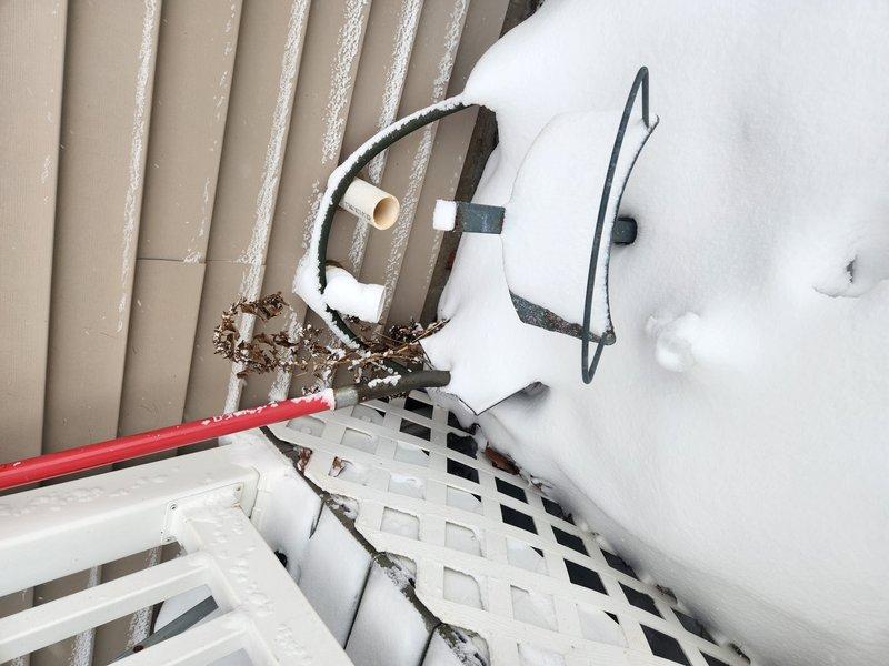 Conducted comprehensive site evaluation for water heater replacement options to address hot water shortage in 10-person household. Provided consultation on two solutions: 75-gallon power vent system requiring possible repiping and code upgrades, or tankless water heater installation. Documented existing gas line configuration and exterior venting conditions during winter conditions.