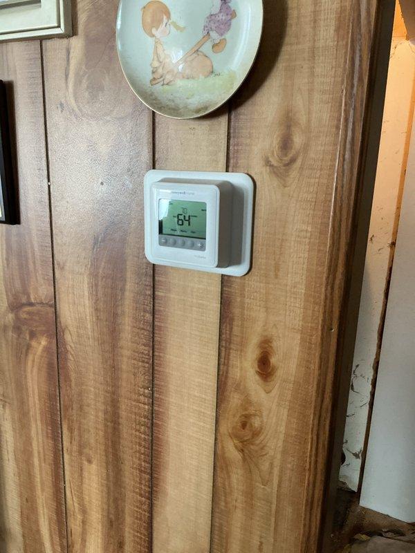 Successfully installed a Lennox ML180DF045E36AK furnace with T4 thermostat per customer specifications. Reconnected unit to existing return filter duct, replaced 1" filter, and verified proper system operation. Installation includes appropriate metal ductwork connections and exhaust venting.