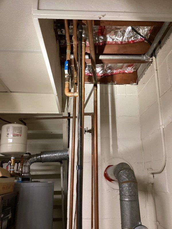 Responded to no-heat call at residence with 30+ year old system. Upon inspection, discovered the aging hydronic heating system with significant corrosion at pipe connections and deteriorating components. Identified failed circulator pump as primary issue and replaced pump to restore proper operation. System now functioning correctly with adequate heat distribution throughout home.