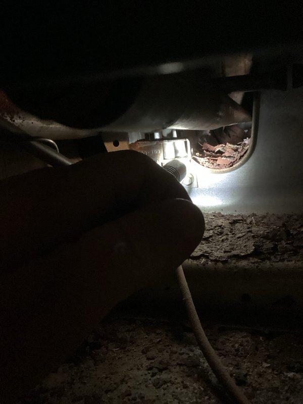 Responded to customer complaint of insufficient heating and burning odor from an aging furnace that was running continuously without reaching setpoint. Inspection revealed significant dust and debris accumulation inside unit with signs of corrosion on copper fittings. Cleaned accumulated debris, inspected connections, and addressed corrosion issues to restore proper system operation and eliminate burning smell.