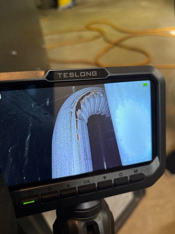 Responded to callback regarding heating system cycling issue with frequent resets required. Used inspection camera to examine system components and identified frost/ice buildup in ductwork. Inspected shut-off valve and associated plumbing components, finding them functional. Previous service had addressed flame sensor with cleaning, but current inspection revealed more extensive issues with system operation requiring further diagnosis.