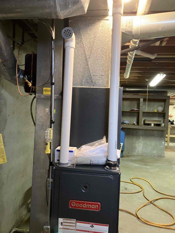 Completed inspection of Goodman furnace experiencing intermittent heating operation requiring manual resets. Diagnosed poor flame signal (previous reading 1.7, improved to 2.1 after cleaning). Recommended and replaced flame sensor to resolve recurring ignition issues. System now operating properly with stable flame signal.
