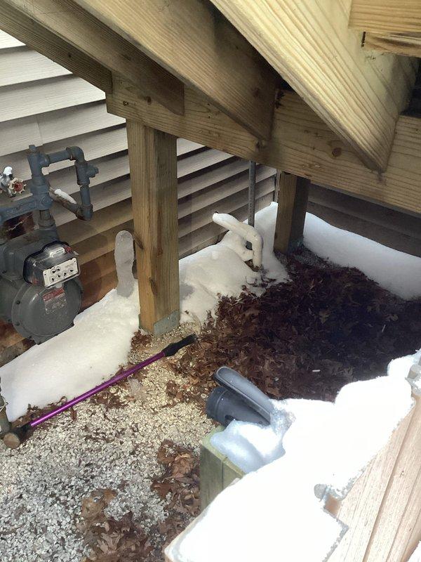 Responded to service call for sump pump drainage issue. Inspected outdoor utility area and basement water treatment system. Diagnosed and cleared clog in sump pump discharge line, restoring proper drainage function. Verified pump operation and confirmed pit water level properly receding after repair.