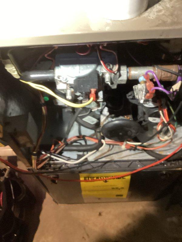 Responded to callback for no heat issue following previous service on 1/27. Diagnosed failure of system to respond to thermostat demand. Inspected internal components including blower motor assembly, wiring connections, and condensate drain system. Restored proper operation by reconnecting loose wiring at motor terminal and clearing condensate safety switch.