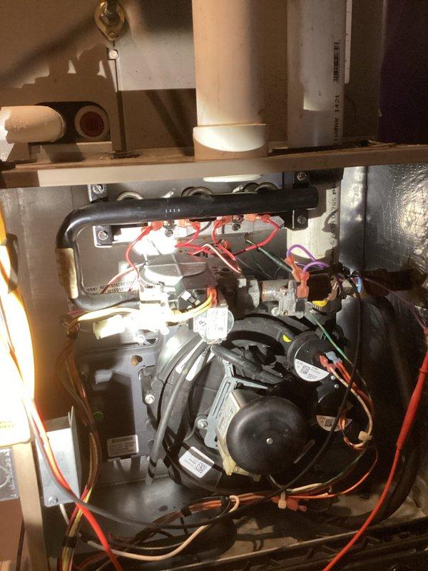 Responded to callback for no heat issue following previous service on 1/27. Diagnosed failure of system to respond to thermostat demand. Inspected internal components including blower motor assembly, wiring connections, and condensate drain system. Restored proper operation by reconnecting loose wiring at motor terminal and clearing condensate safety switch.