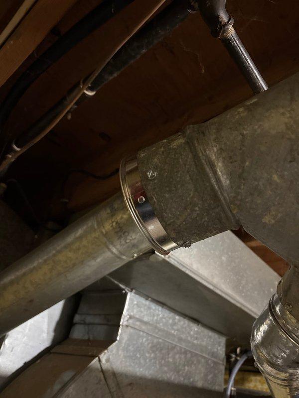 Responded to callback regarding exhaust support issues. Inspected and secured loose connection on round metal duct with metal band clamp and screws. Verified proper installation of exhaust cap to ensure adequate ventilation.
