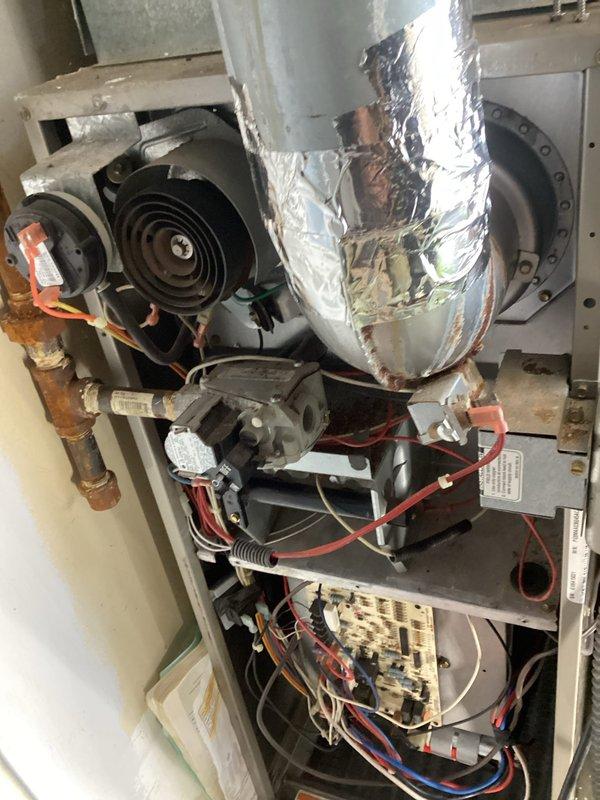 Responded to no heat complaint at residence, accessing via side door as requested. Upon inspection, found system was operational but not producing adequate heat. Examined control board and blower assembly, which showed normal operation with no visible damage. Performed diagnostic testing on electrical components and verified proper connections to terminal blocks. System is now functioning correctly and delivering appropriate heat levels.