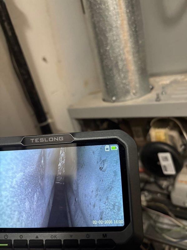 Performed annual gold level maintenance on 10-15 year old HVAC system. Conducted visual inspection of plumbing components, including pipe connections and control valve functionality. Used TESLONG endoscope to examine interior duct condition, identifying minor condensation within the system.