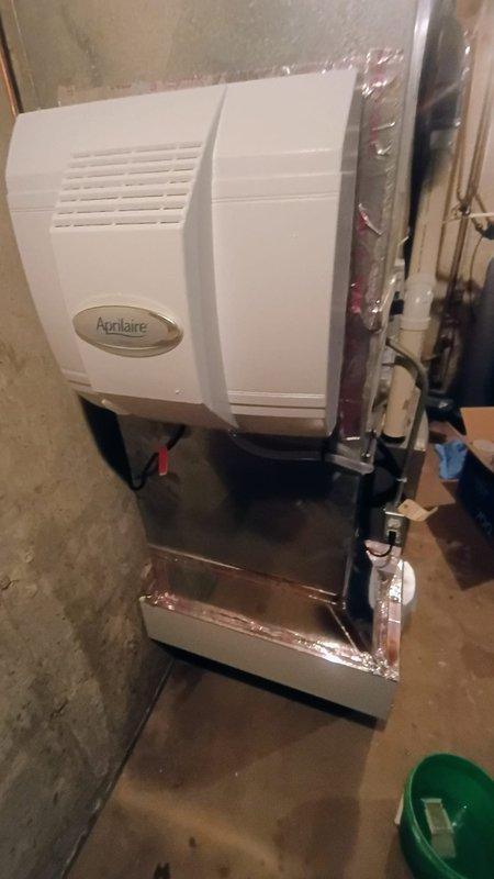 Successfully installed a new Aprilaire whole-home humidifier on the customer's HVAC system. Unit was properly mounted on the furnace with all necessary plumbing connections completed using PVC piping. System is now operational with proper water supply connections.