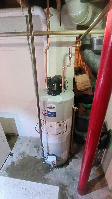 Successfully completed replacement of a residential tanked water heater as quoted. Installed new unit with proper copper pipe connections for hot and cold water lines, ensuring all fittings were secure and leak-free. System is now operational with appropriate drainage setup in the basement utility area.