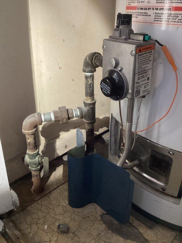 Responded to service call for 20-year-old water heater with pilot light failure. Inspected gas valve assembly and ignition system, which showed significant wear and corrosion on components. Replaced thermocouple and cleaned pilot assembly to restore proper ignition function, returning water heater to normal operation.