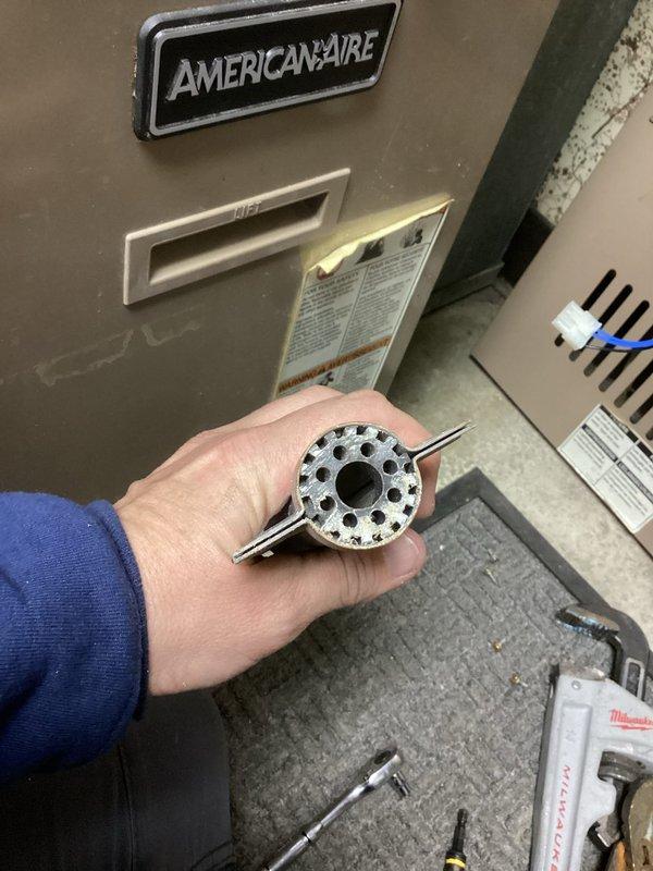 Responded to no heat call for 10+ year old American-Aire furnace. Diagnosed faulty gas valve and contaminated burners affecting combustion. Successfully replaced gas valve assembly and performed thorough burner cleaning to restore proper heating function.