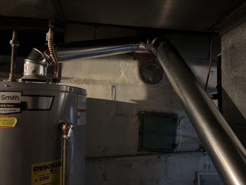 Successfully installed a chimney liner for the HVAC system, properly connecting the Lennox furnace and A.O. Smith ProLine water heater to the new ventilation components. All metal ductwork and vent piping were secured with appropriate brackets, ensuring proper exhaust flow and system safety.