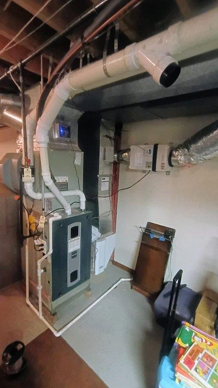 Completed installation of air scrubber and ventilator systems in basement mechanical area per approved quote specifications. Integrated new components with existing HVAC system, connecting to furnace unit and ductwork. Installation will enhance indoor air quality through advanced filtration and improved ventilation.