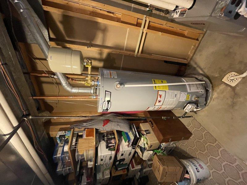 Replaced 8-year-old leaking water heater with new unit, including installation of expansion tank and necessary brass valve assembly with Webstone components. All copper pipes and fittings were properly connected to ensure reliable operation throughout the residence, with work completed within the scheduled 2-hour window.