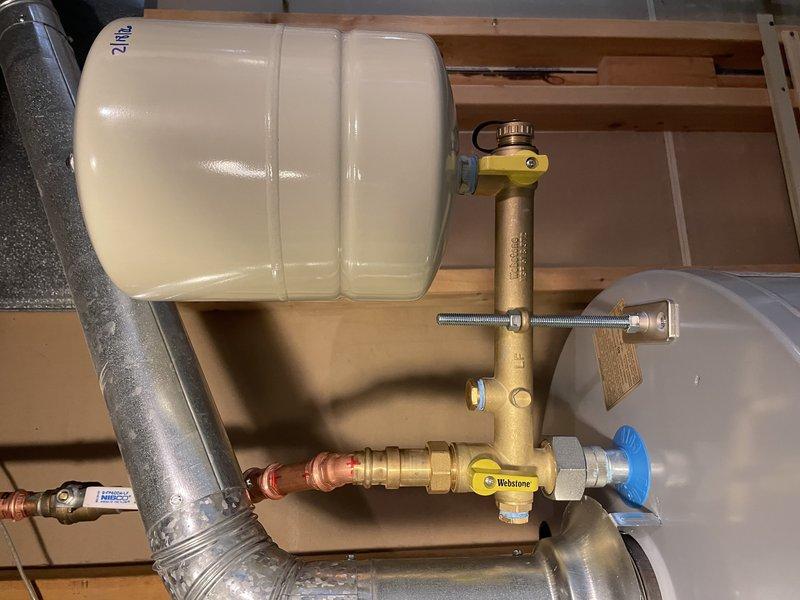 Replaced 8-year-old leaking water heater with new unit, including installation of expansion tank and necessary brass valve assembly with Webstone components. All copper pipes and fittings were properly connected to ensure reliable operation throughout the residence, with work completed within the scheduled 2-hour window.
