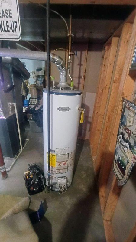 Responded to a water leak complaint near water heater in basement. Upon inspection, identified leak at copper pipe fitting above the A.O. Smith GCR-40 410 40-gallon natural gas water heater. Repaired damaged fitting, pressure tested system, and confirmed proper operation with no further leakage detected.