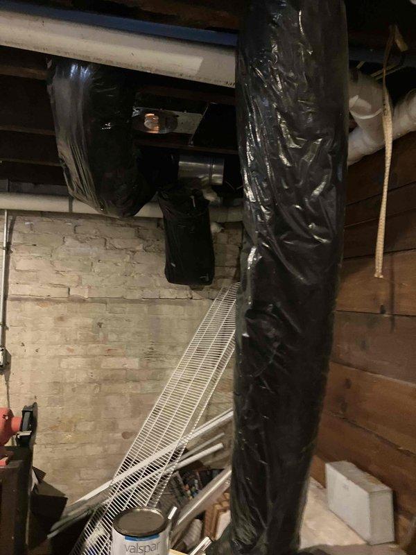 Inspected non-operational furnace after basement flooding incident. System appears to have sustained water damage with no airflow through vents and home temperature at 52°F. Conducted visual assessment of ductwork, air handler components, and insulated piping. Recommended complete furnace replacement due to water damage and safety concerns.