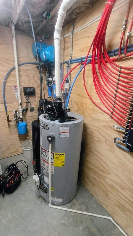Diagnosed and replaced malfunctioning pressure switch (part #100112658) on 3-year-old tanked water heater that was not turning on or lighting. Verified proper operation after replacement and confirmed no water leakage issues with the system.