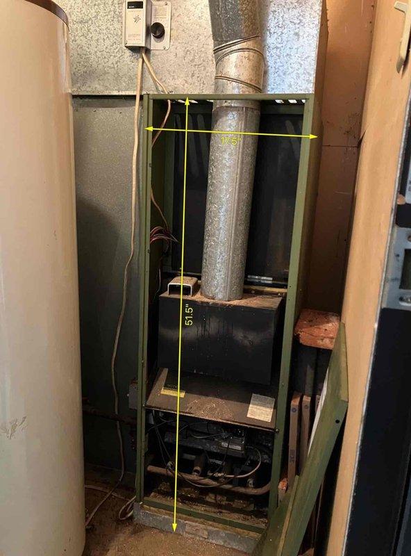 Conducted diagnostic assessment on non-operational furnace system after gas company identified rusted vent pipe as cause of failure. Inspection revealed significant water damage around ceiling penetration and corrosion on the exhaust components. Measurements were taken (73" x 51.5") for complete HVAC system replacement due to age-related deterioration and safety concerns with the existing unit.