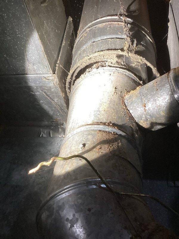 Installed customer-supplied tanked water heater that was previously non-functional. Inspected existing ventilation system and connections, noting some corrosion around connection points and dust accumulation on ductwork. Successfully completed installation with all proper connections to ensure safe and efficient operation.