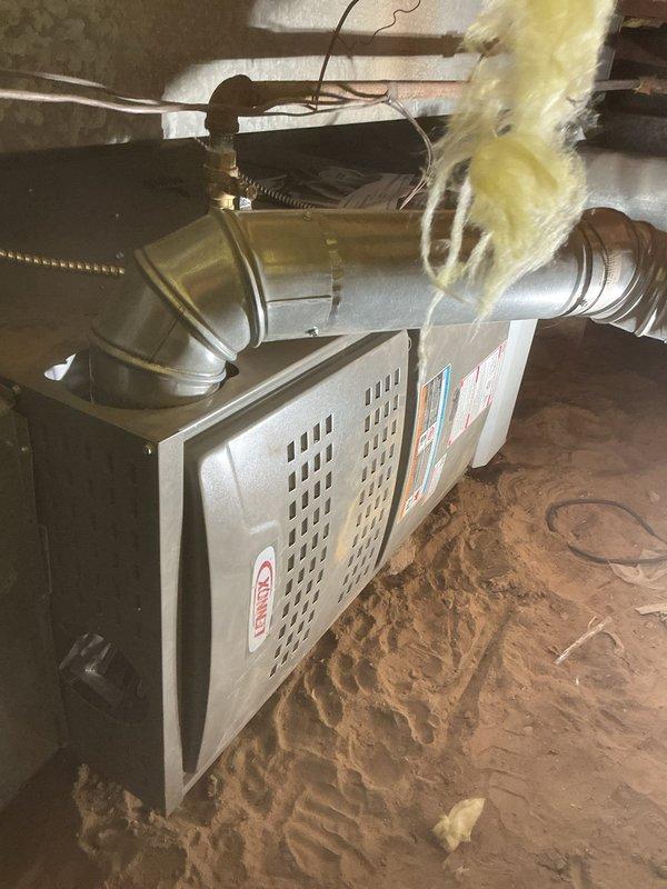 Successfully installed Lennox ML180UH070E36BK furnace in crawl space with 1410 media air cabinet and filter. Connected unit to existing venting system and reconfigured ductwork with proper insulation while retaining customer's existing thermostat for system control.