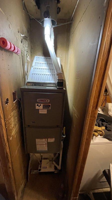 Successfully installed a Lennox ML196 downflow furnace with first-time PVC venting through existing roof jack. Fabricated custom door for coil box and constructed filter rack according to specifications. Inspected and verified proper condensate drainage with backup pump installed as precautionary measure.