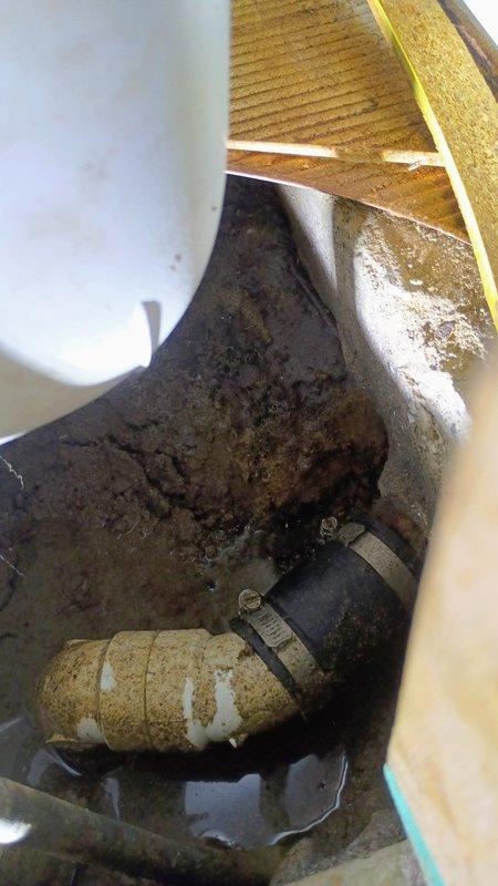 Responded to emergency service call for bathtub drain leak causing water accumulation on bathroom floor. Upon inspection, identified faulty PVC pipe connection in the crawl space beneath the bathroom. Repaired the compromised section by replacing the damaged fitting and securing with appropriate metal clamps, successfully resolving the leak and restoring proper drainage function.