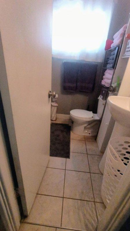 Responded to emergency service call for bathtub drain leak causing water accumulation on bathroom floor. Upon inspection, identified faulty PVC pipe connection in the crawl space beneath the bathroom. Repaired the compromised section by replacing the damaged fitting and securing with appropriate metal clamps, successfully resolving the leak and restoring proper drainage function.