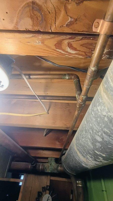 Conducted inspection of residential plumbing system, specifically examining two failing shut-off valves requiring replacement. Assessment revealed water damage on wooden subfloor and joists, with existing copper pipe infrastructure that customer is considering converting to PEX. Provided professional consultation regarding shower plumbing concerns and recommendations for proper pipe replacement methodology.