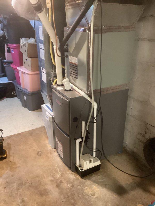 Successfully installed a Lennox ML196UH070 furnace with T4 thermostat and 1610 media air cleaner in basement utility area. System was properly connected to existing ductwork with new PVC ventilation piping and all electrical components were wired according to manufacturer specifications. Final inspection confirmed proper operation of all installed components.